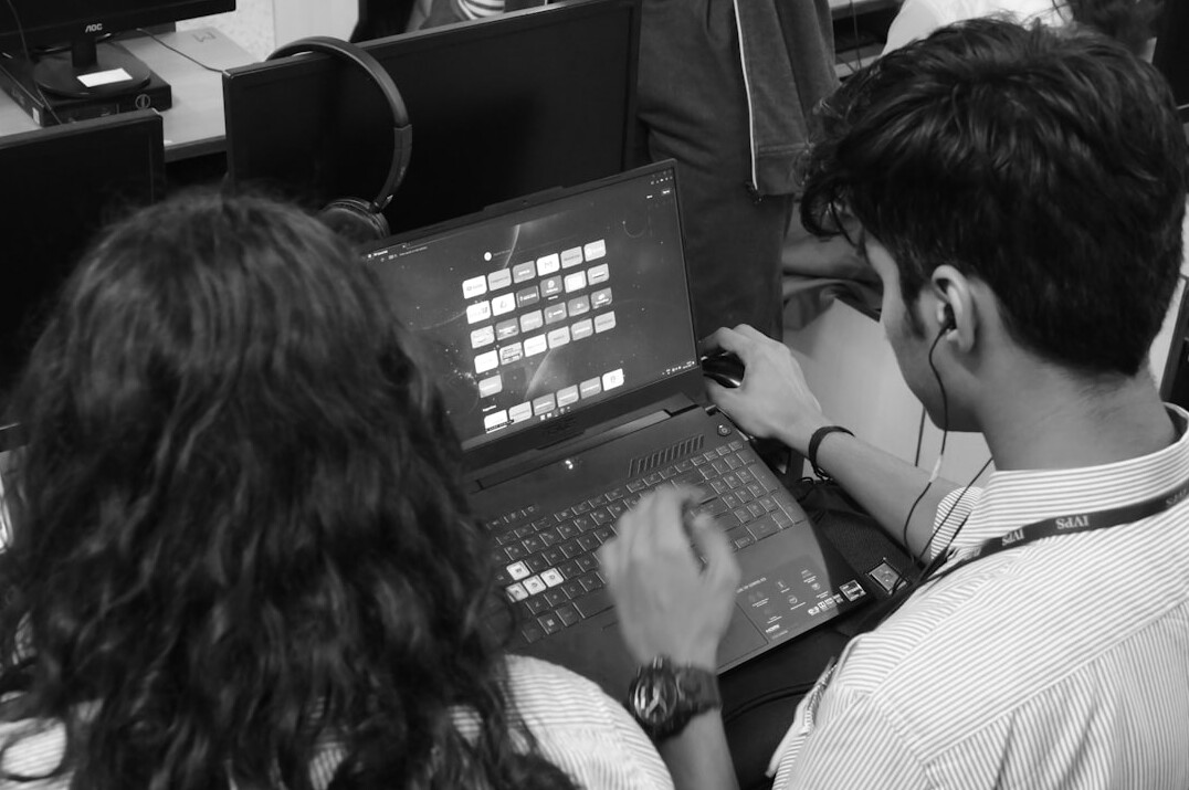 group of students coding together