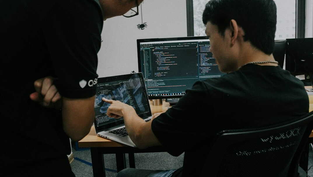 group of students discussing code