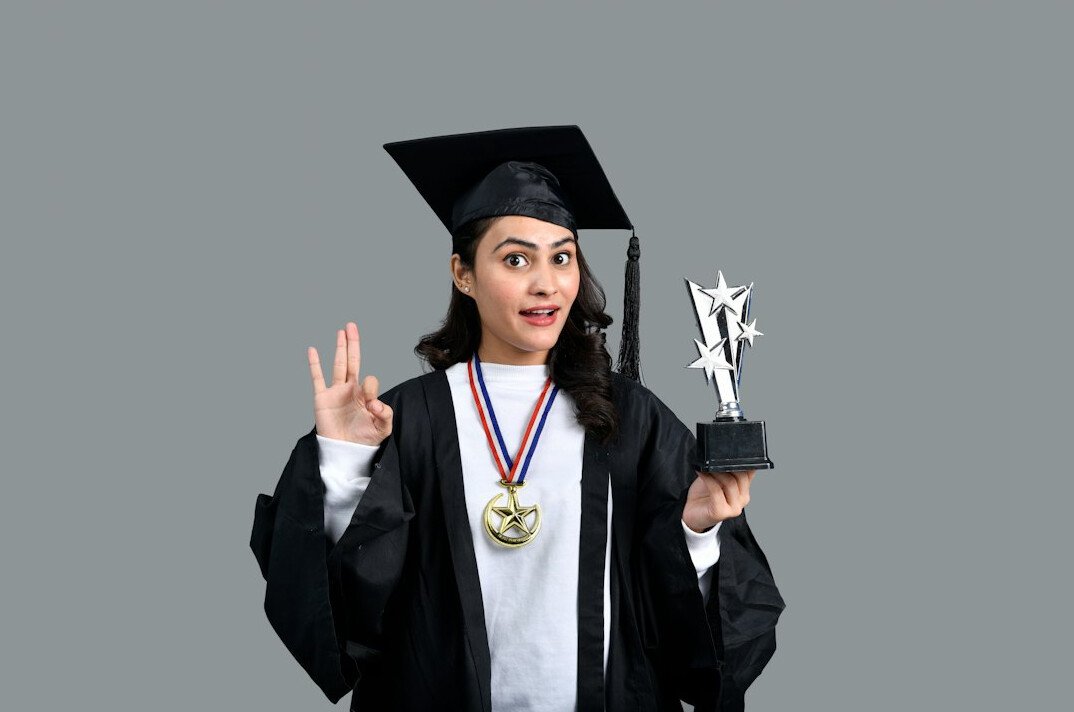 successful graduate holding certificate