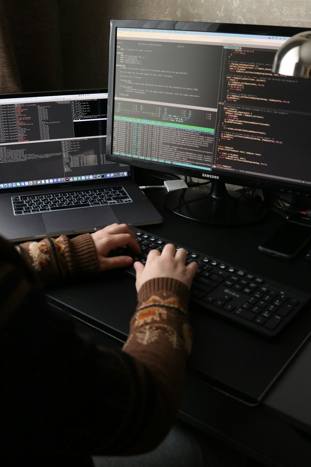team reviewing code on monitor