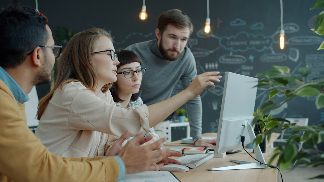 diverse team discussing code